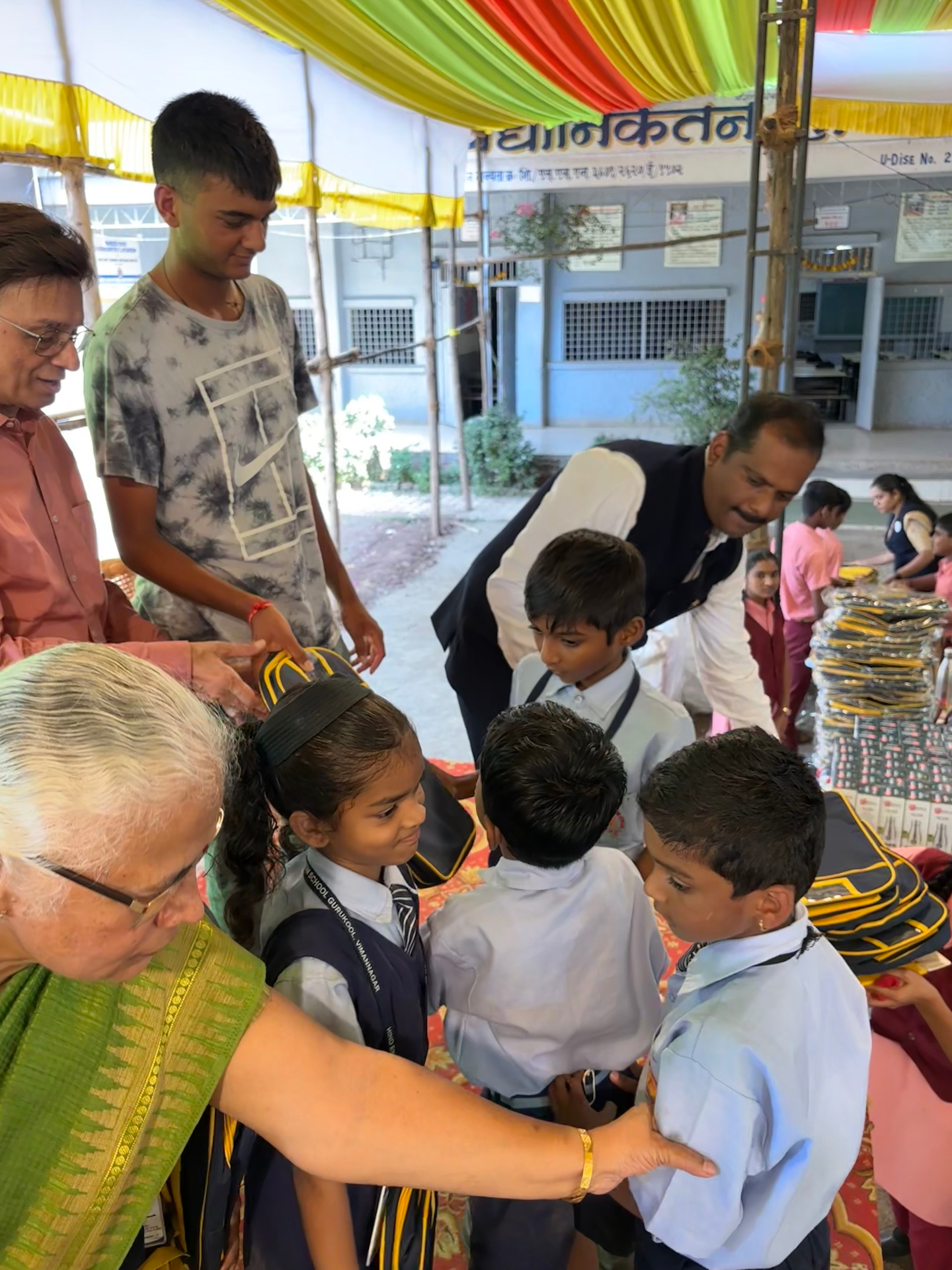 Students receiving backpacks and supplies